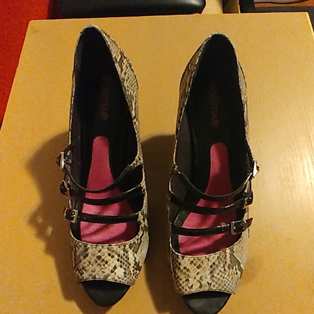 Snakeskin and patent pumps